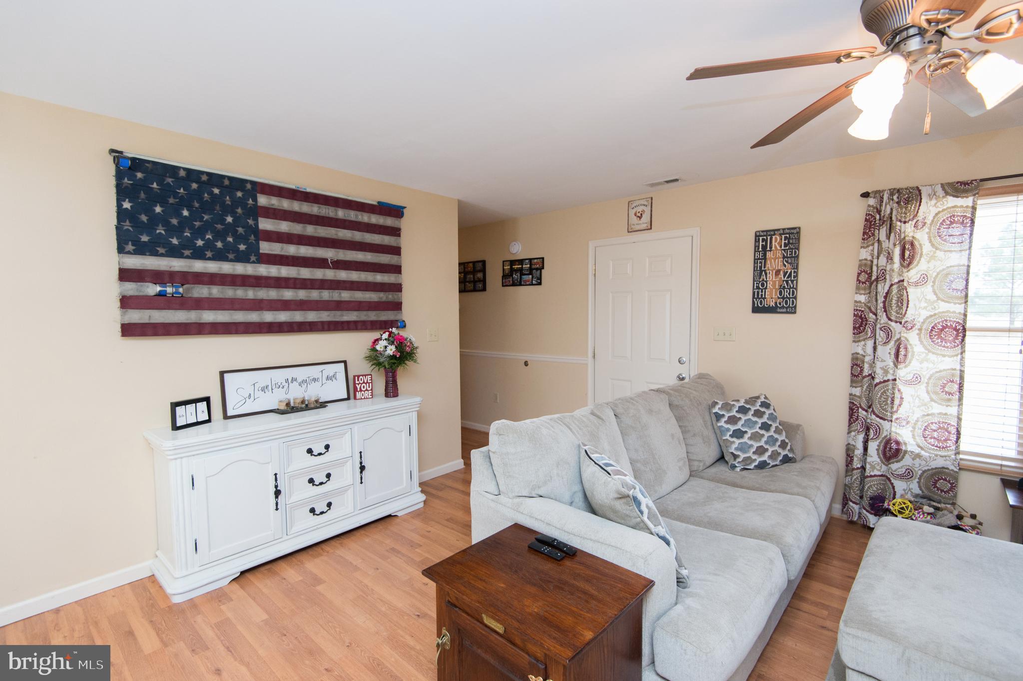 6568 Statum Road Preston, MD 21655 - Photo 12 of 49 a living room with furniture and wooden floor