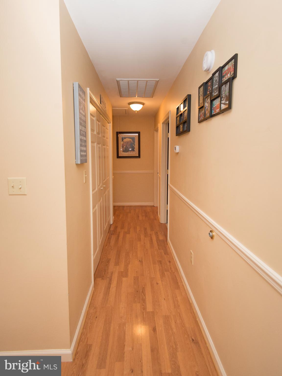 6568 Statum Road Preston, MD 21655 - Photo 13 of 49 a view of a hallway with wooden floor