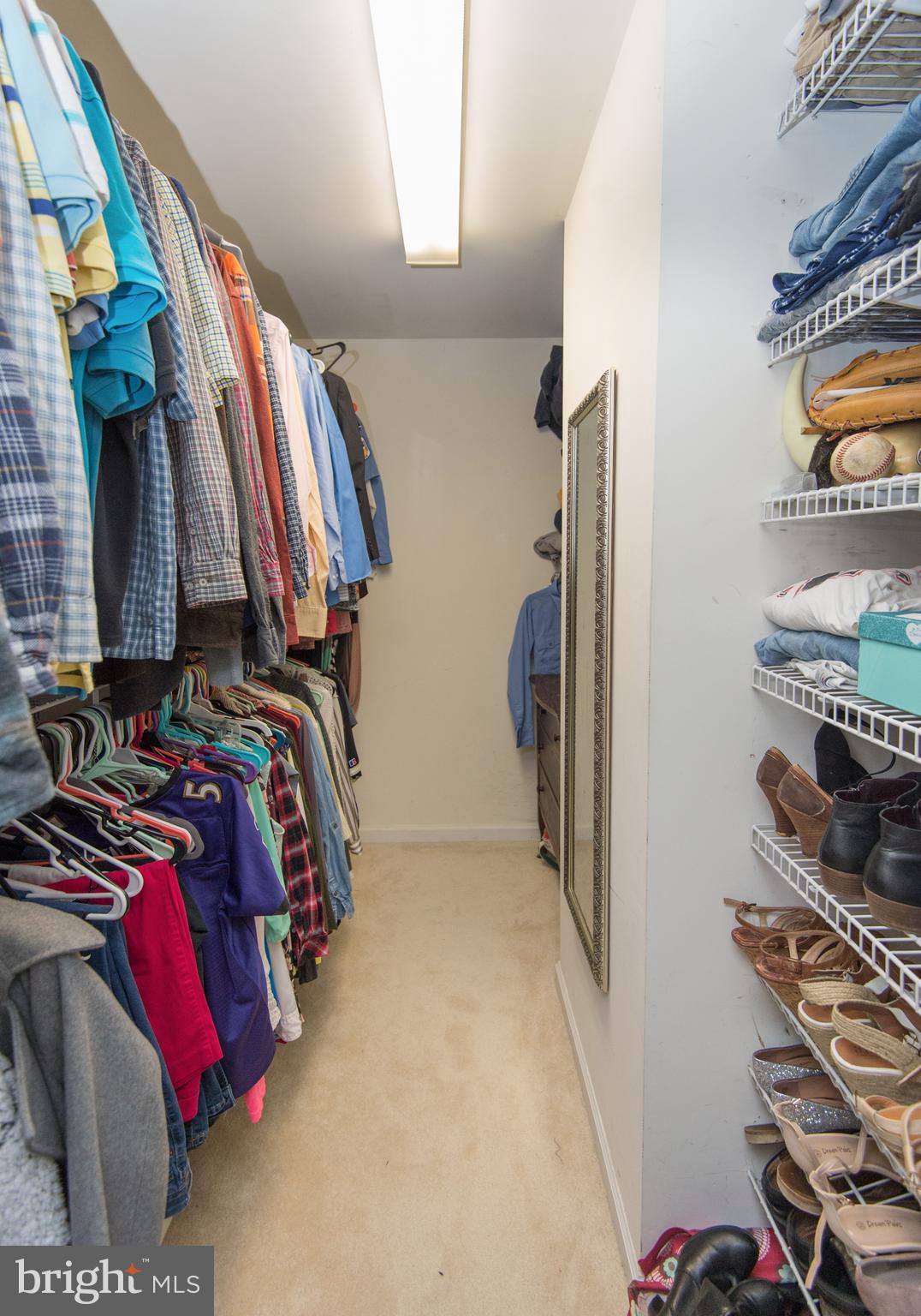 6568 Statum Road Preston, MD 21655 - Photo 18 of 49 a view of walk in closet with clothes and shoes