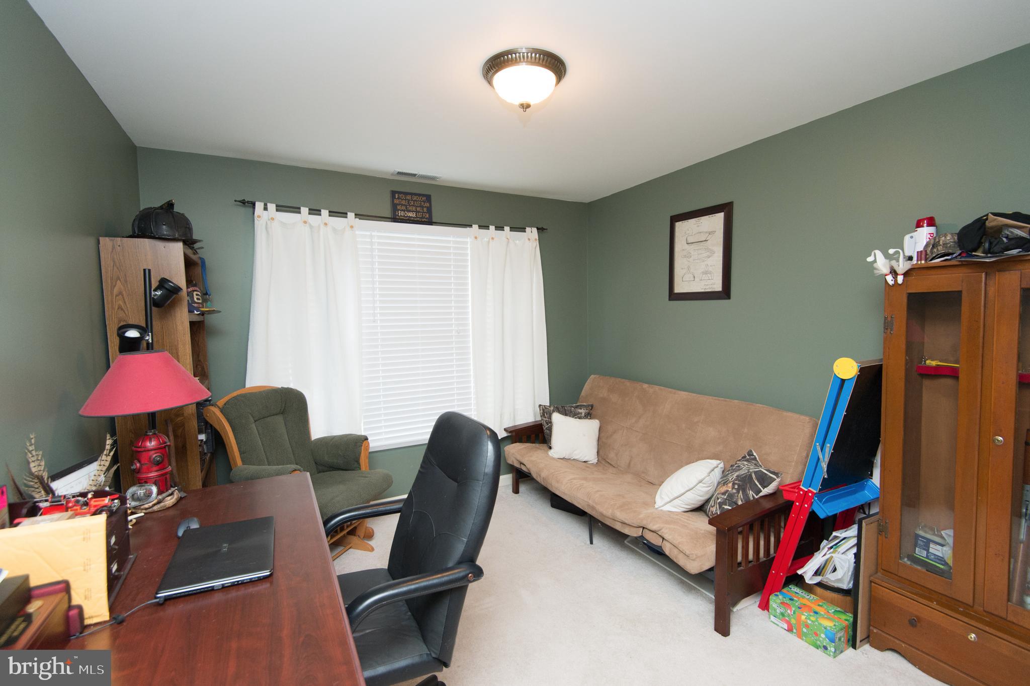 6568 Statum Road Preston, MD 21655 - Photo 24 of 49 a living room with furniture and a window