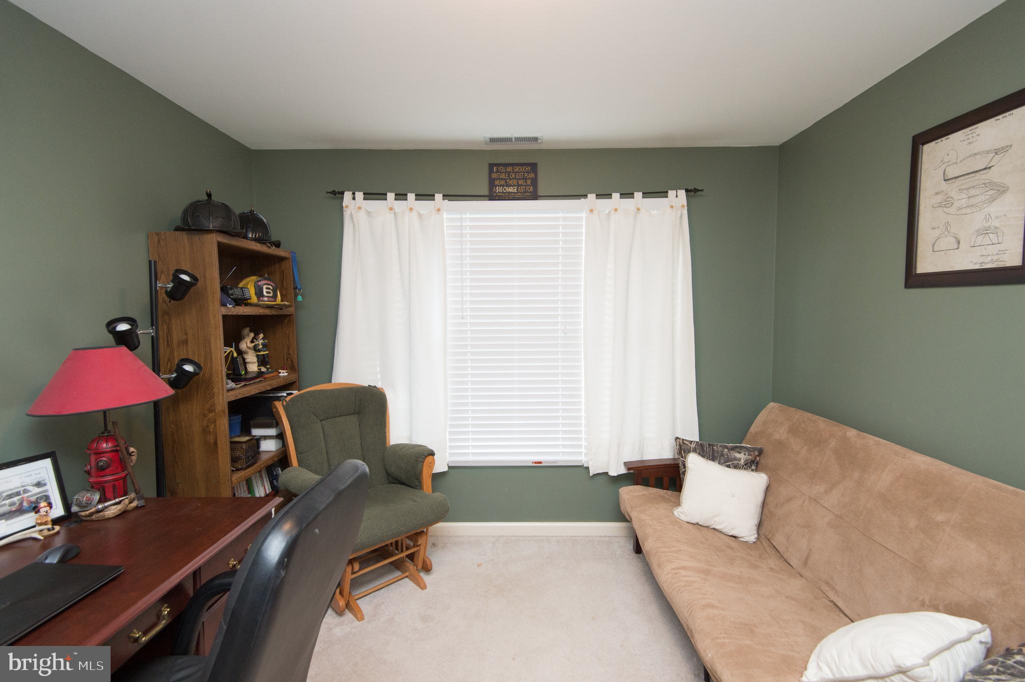 6568 Statum Road Preston, MD 21655 - Photo 25 of 49 a living room with furniture and a window