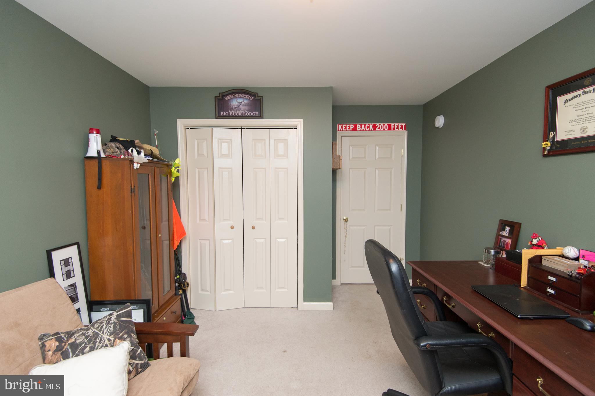 6568 Statum Road Preston, MD 21655 - Photo 26 of 49 a view of a workspace with furniture and a gate