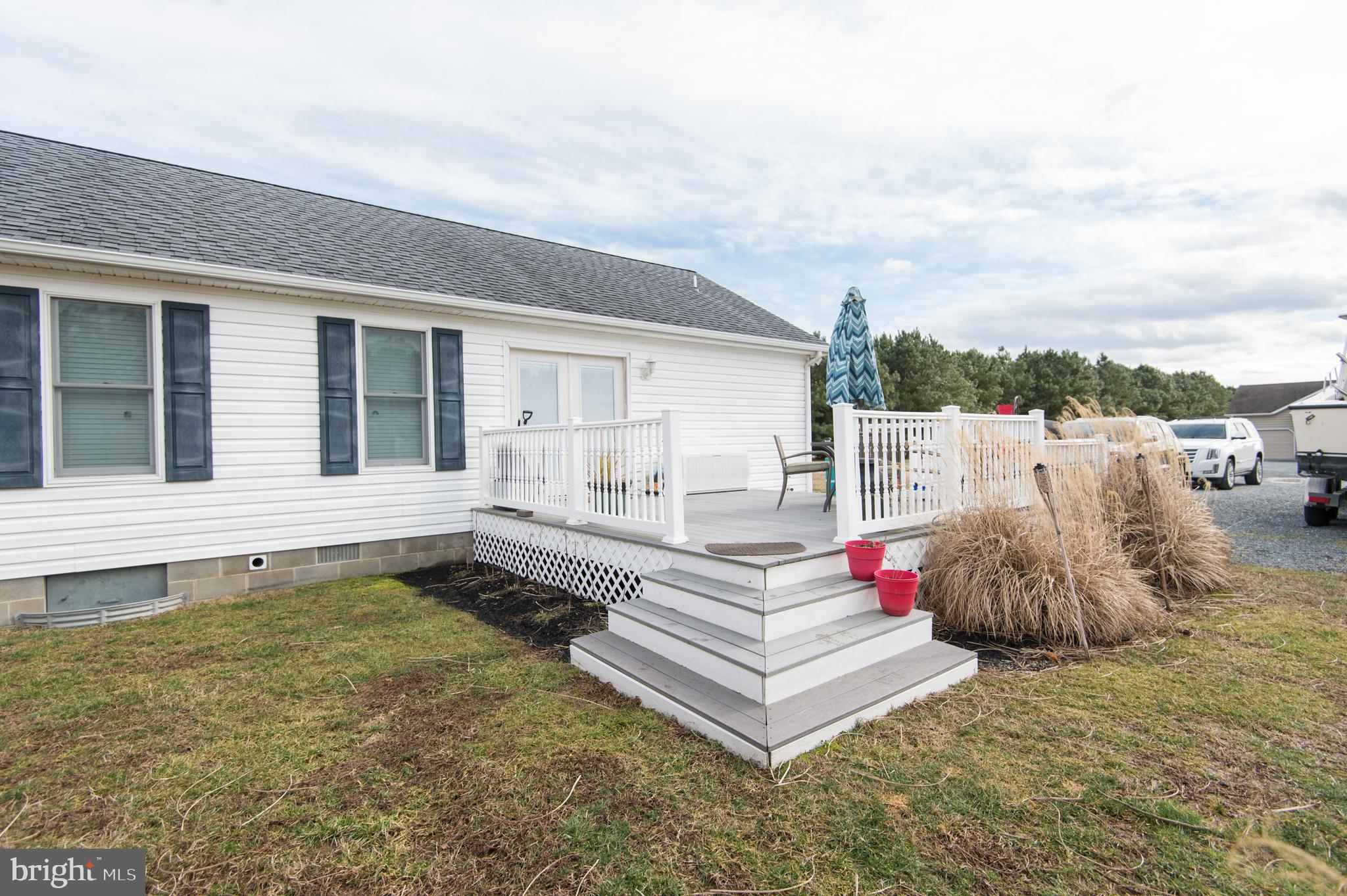 6568 Statum Road Preston, MD 21655 - Photo 32 of 49 a front view of a house with a garden
