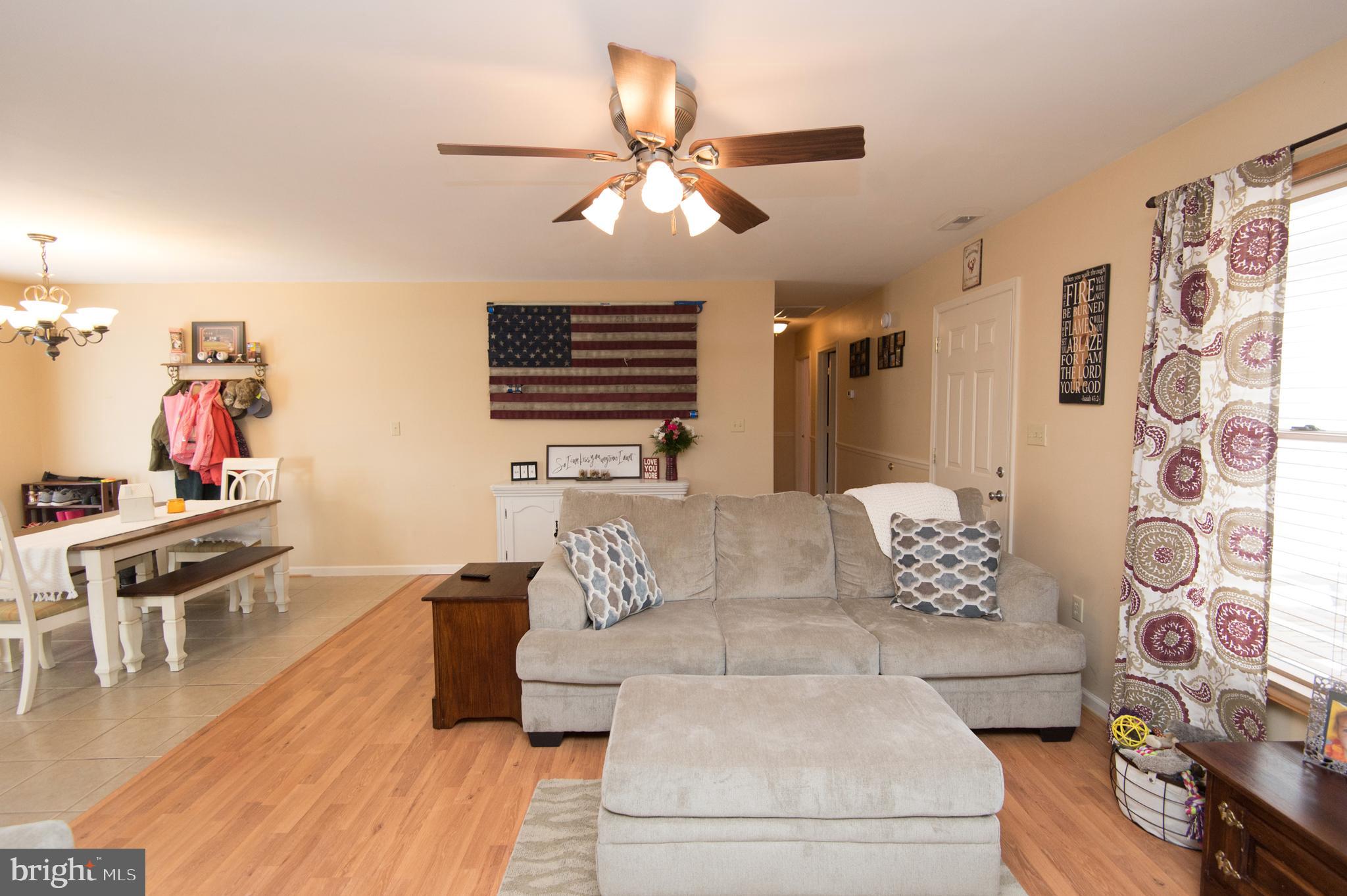 6568 Statum Road Preston, MD 21655 - Photo 5 of 49 a living room with furniture and wooden floor