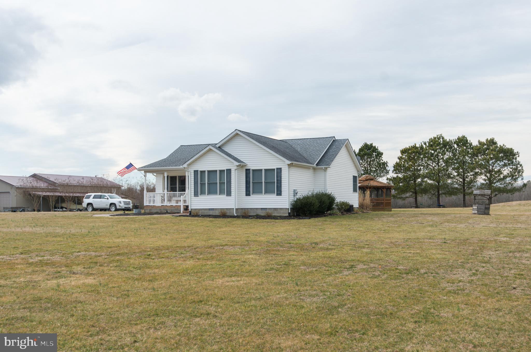 6568 Statum Road Preston, MD 21655 - Photo 41 of 49 a front view of a house with a yard
