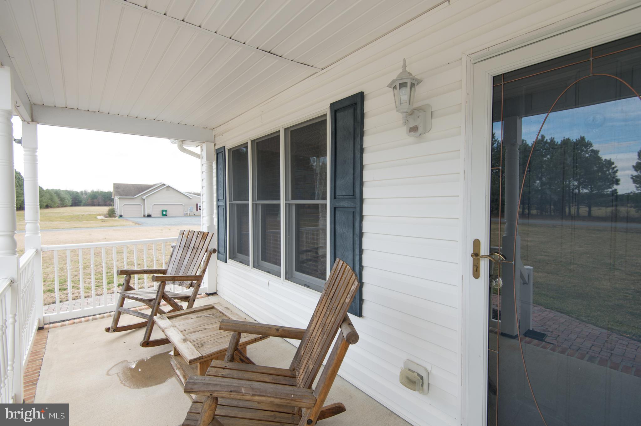 6568 Statum Road Preston, MD 21655 - Photo 47 of 49 a balcony with table and chairs