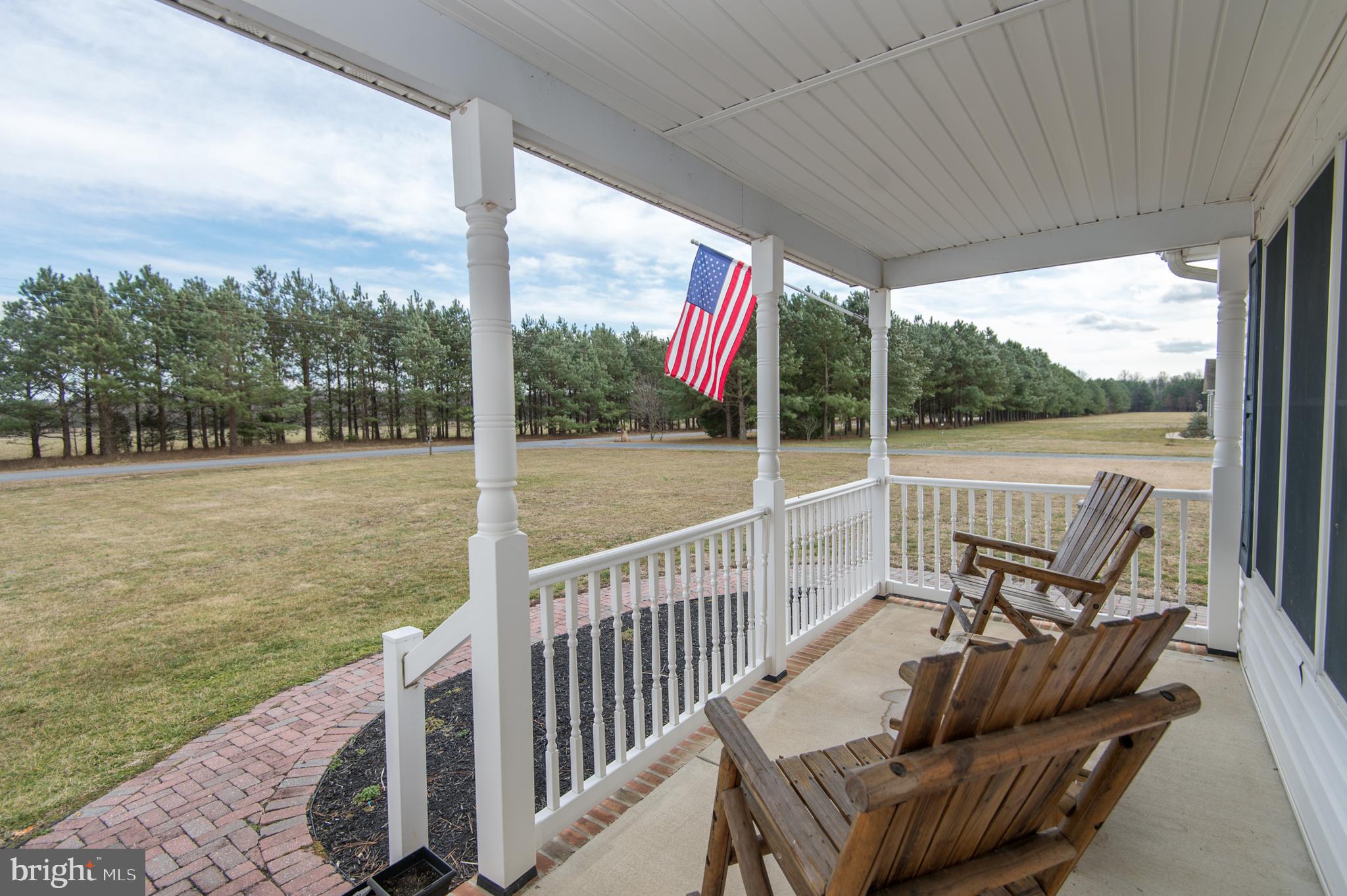 6568 Statum Road Preston, MD 21655 - Photo 48 of 49 a view of a chair and tables in the balcony