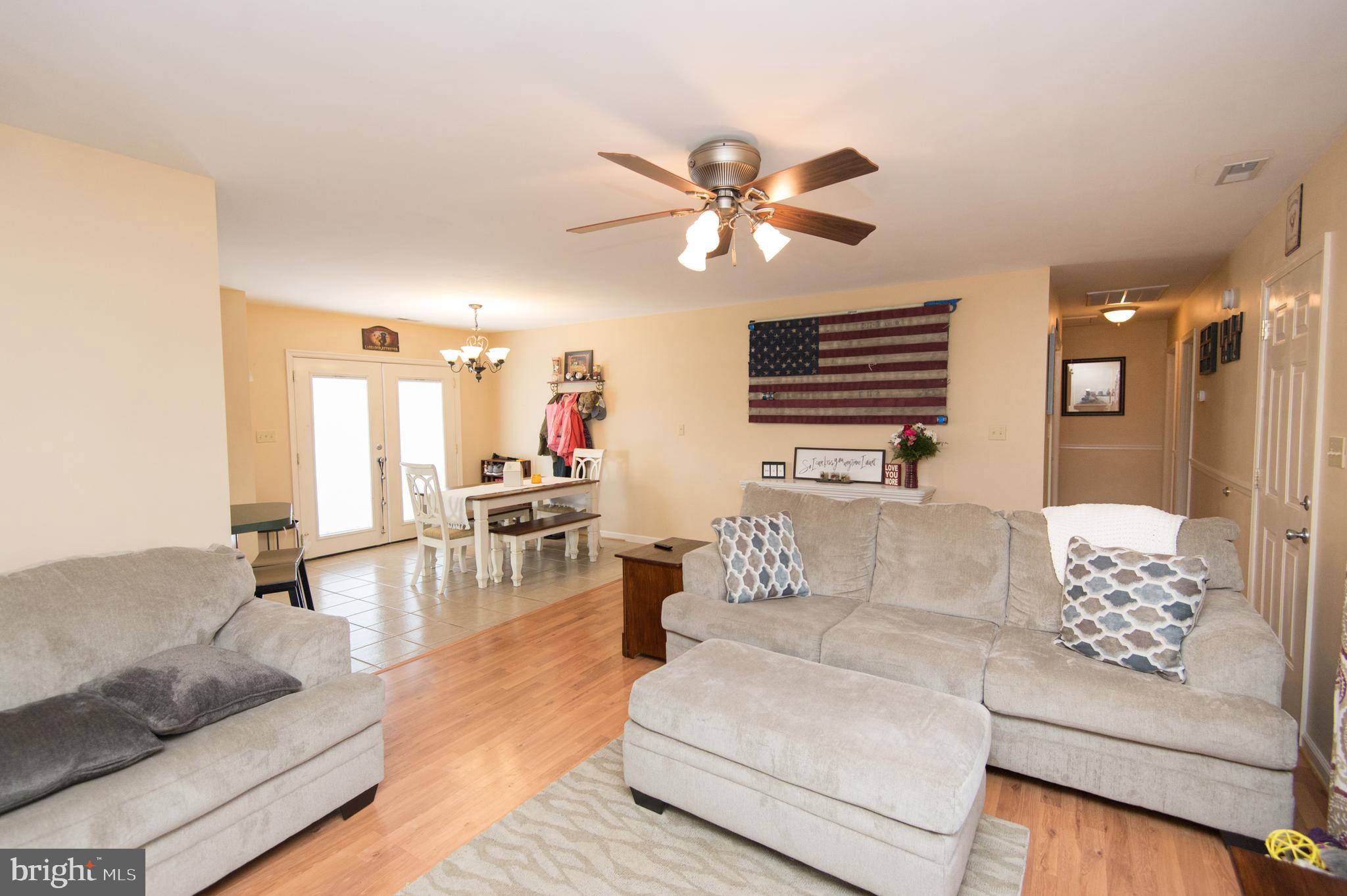 6568 Statum Road Preston, MD 21655 - Photo 6 of 49 a living room with furniture and a large window