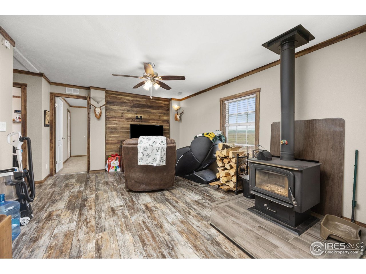 55102 County Road 21 Carr, CO 80612 - Photo 14 of 34 a living room with furniture and a fireplace