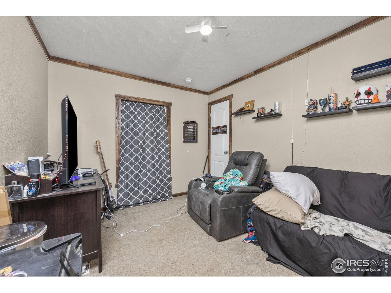 55102 County Road 21 Carr, CO 80612 - Photo 21 of 34 a living room with furniture and a flat screen tv