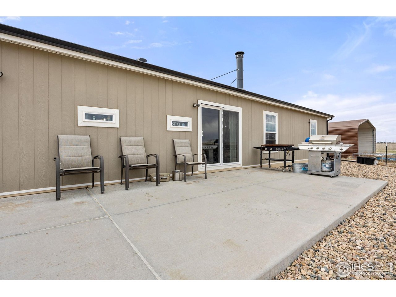 55102 County Road 21 Carr, CO 80612 - Photo 25 of 34 a view of a livingroom with furniture and a stove