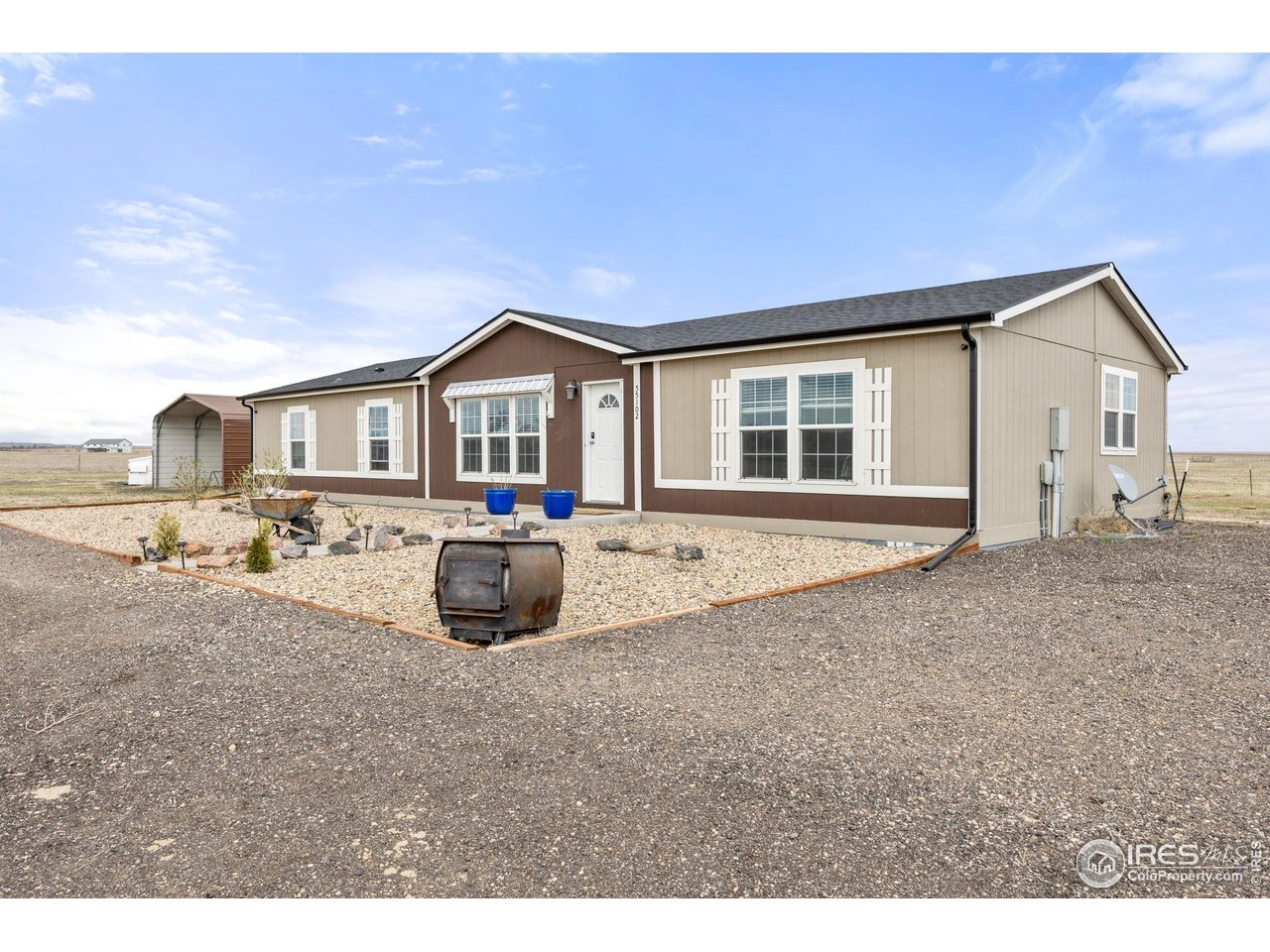 55102 County Road 21 Carr, CO 80612 - Photo 5 of 34 a view of a house with backyard and sitting area