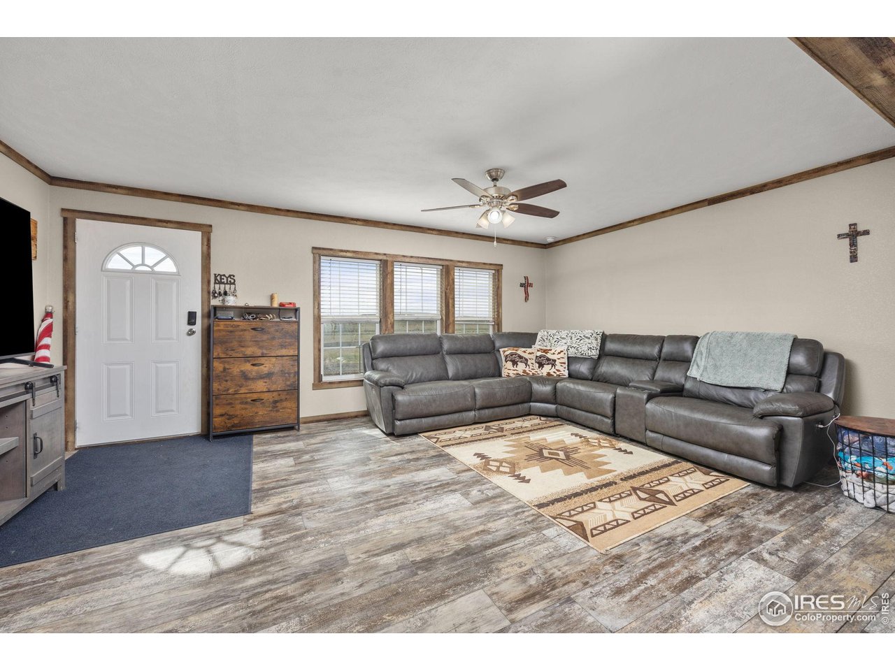55102 County Road 21 Carr, CO 80612 - Photo 8 of 34 a living room with furniture and wooden floor