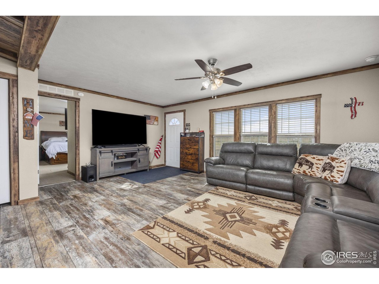 55102 County Road 21 Carr, CO 80612 - Photo 10 of 34 a living room with furniture and a flat screen tv