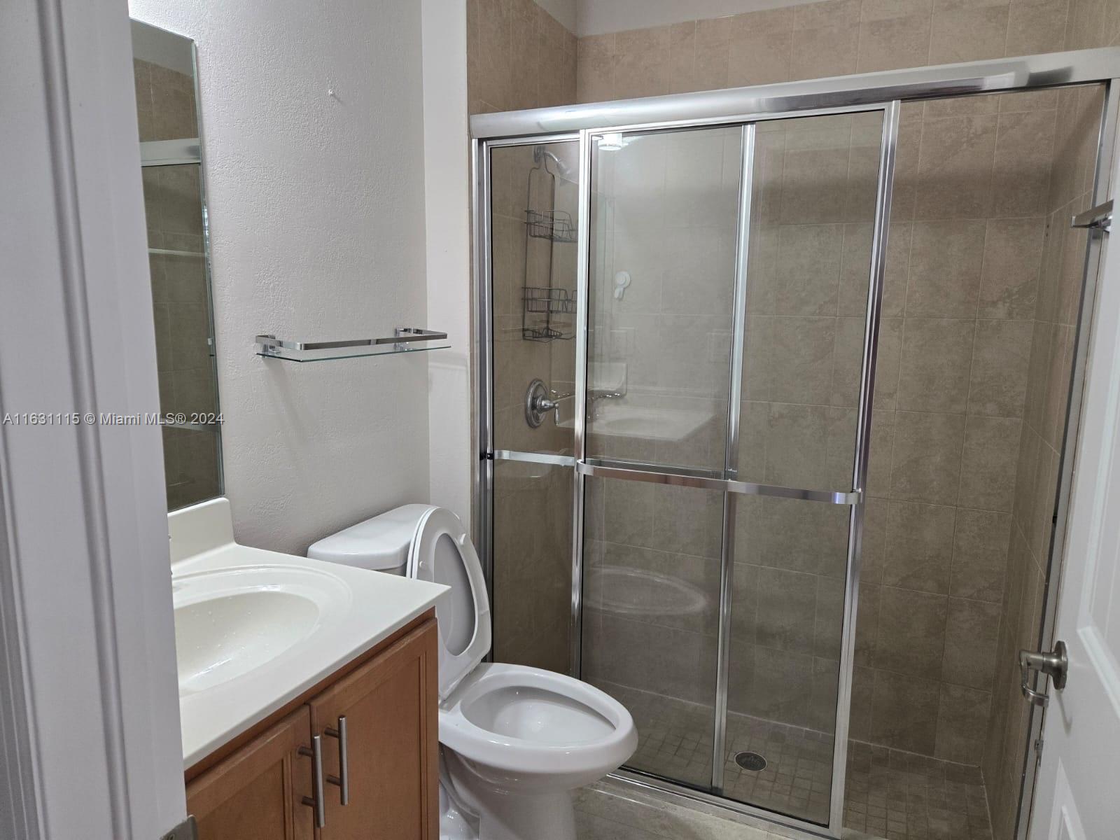28407 Southwest 129th Place Homestead, FL 33033 - Photo 11 of 17 a bathroom with a toilet and a shower