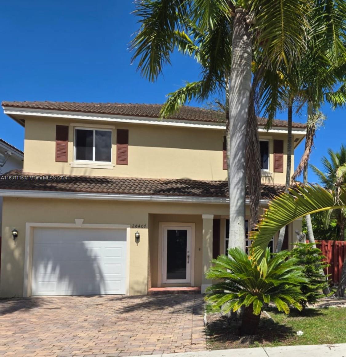 28407 Southwest 129th Place Homestead, FL 33033 - Photo 2 of 17 a front view of a house with a garden