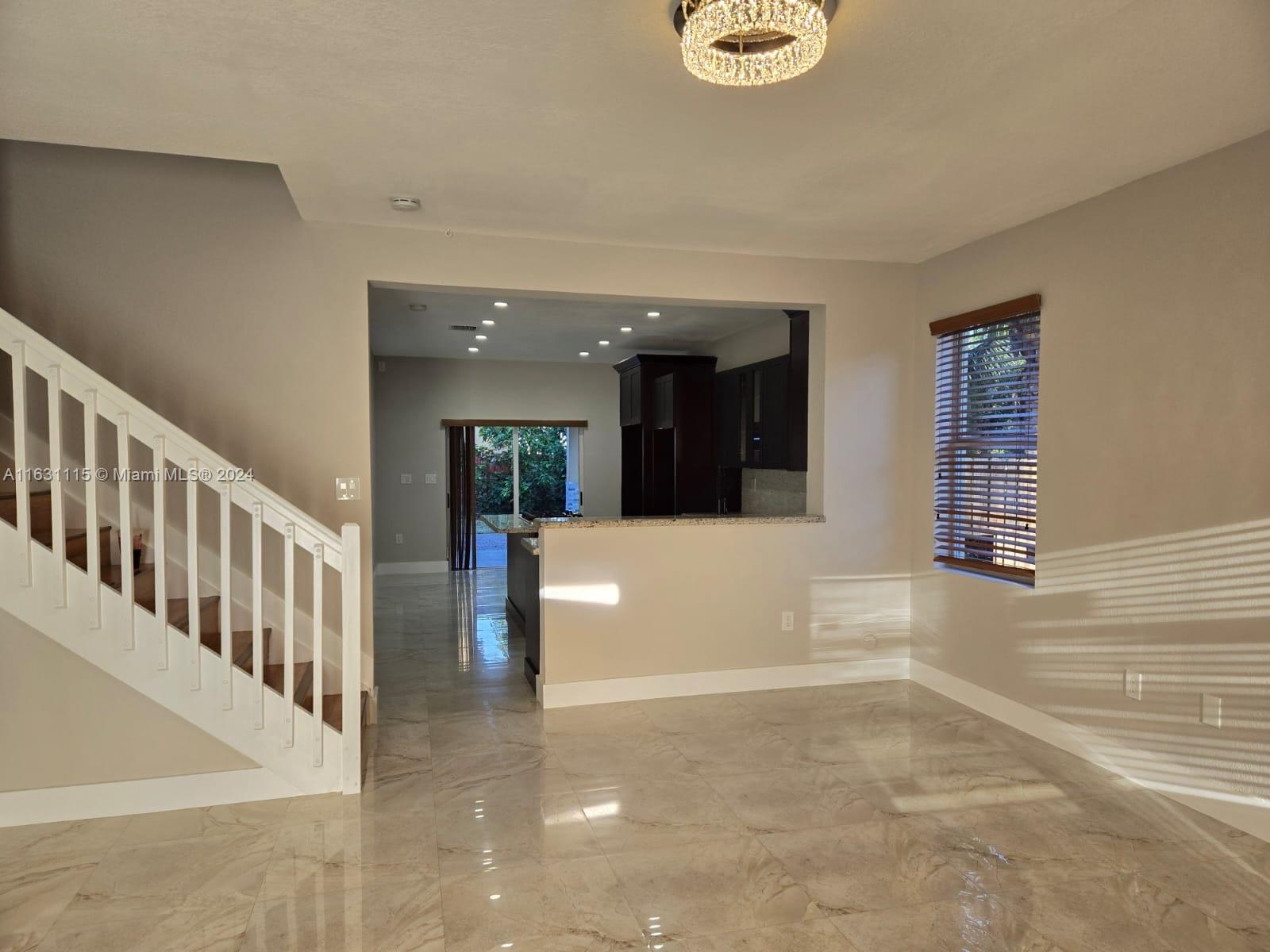 28407 Southwest 129th Place Homestead, FL 33033 - Photo 3 of 17 a view of a hallway with windows