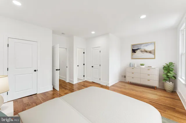 a bedroom with a bed and a couch