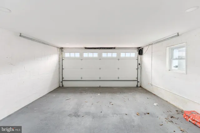 an empty room with a empty space and windows