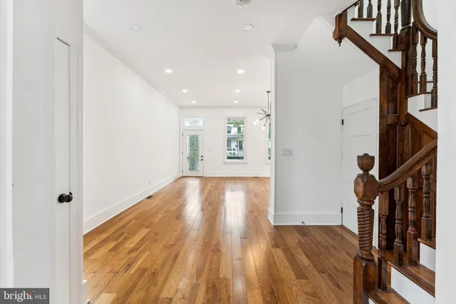 a view of an entryway with wooden floor