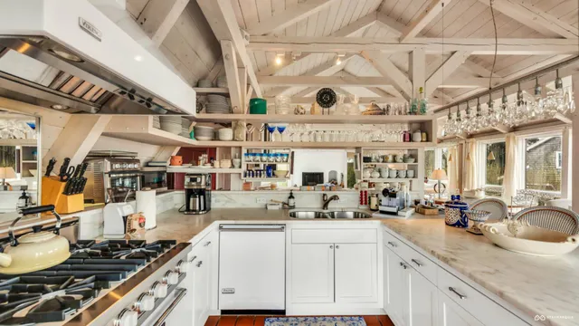 a kitchen with a stove and cabinets