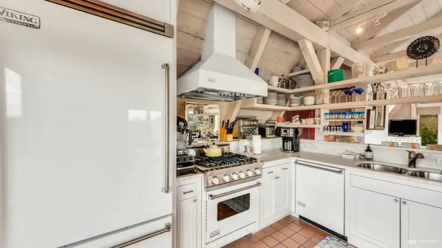 a kitchen with a stove and cabinets