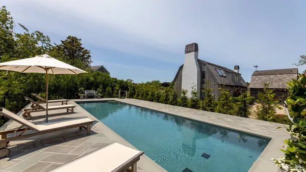 a view of a swimming pool with a patio