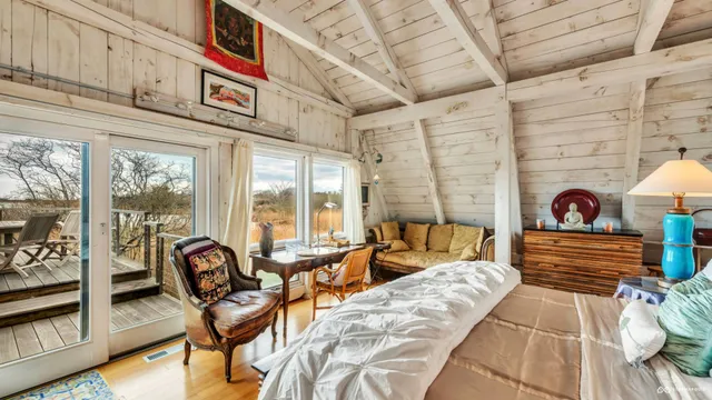 a bedroom with a bed and a couch