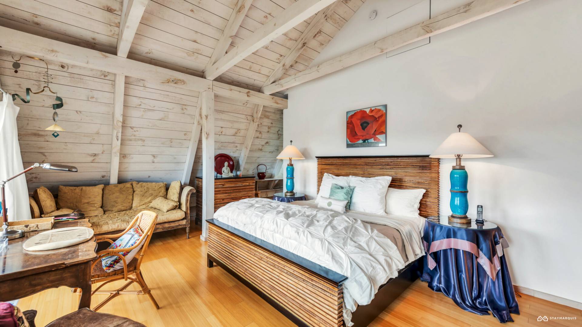 1100 Ocean Road Bridgehampton, NY 11932 - Photo 25 of 49 a bedroom with a bed and a couch