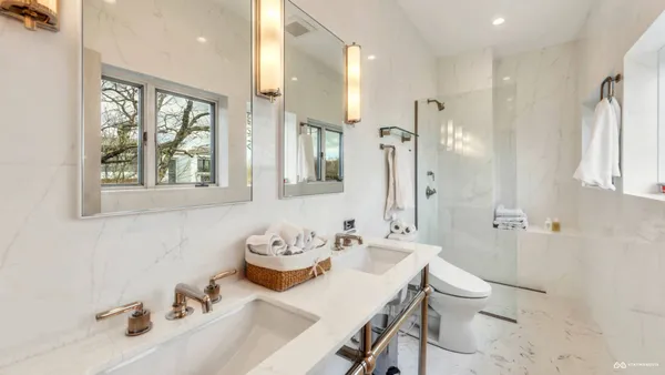 a bathroom with a tub and a shower