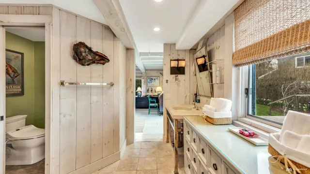 a bathroom with a sink double vanity and a mirror