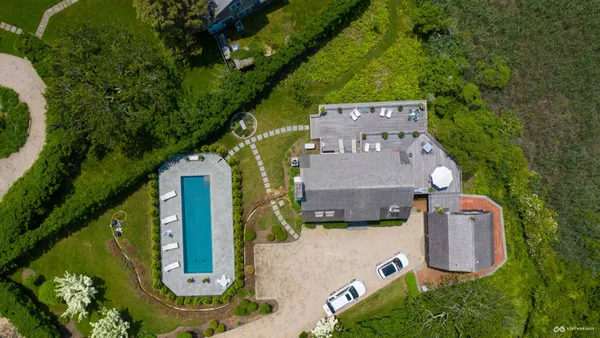 an aerial view of a house with a garden