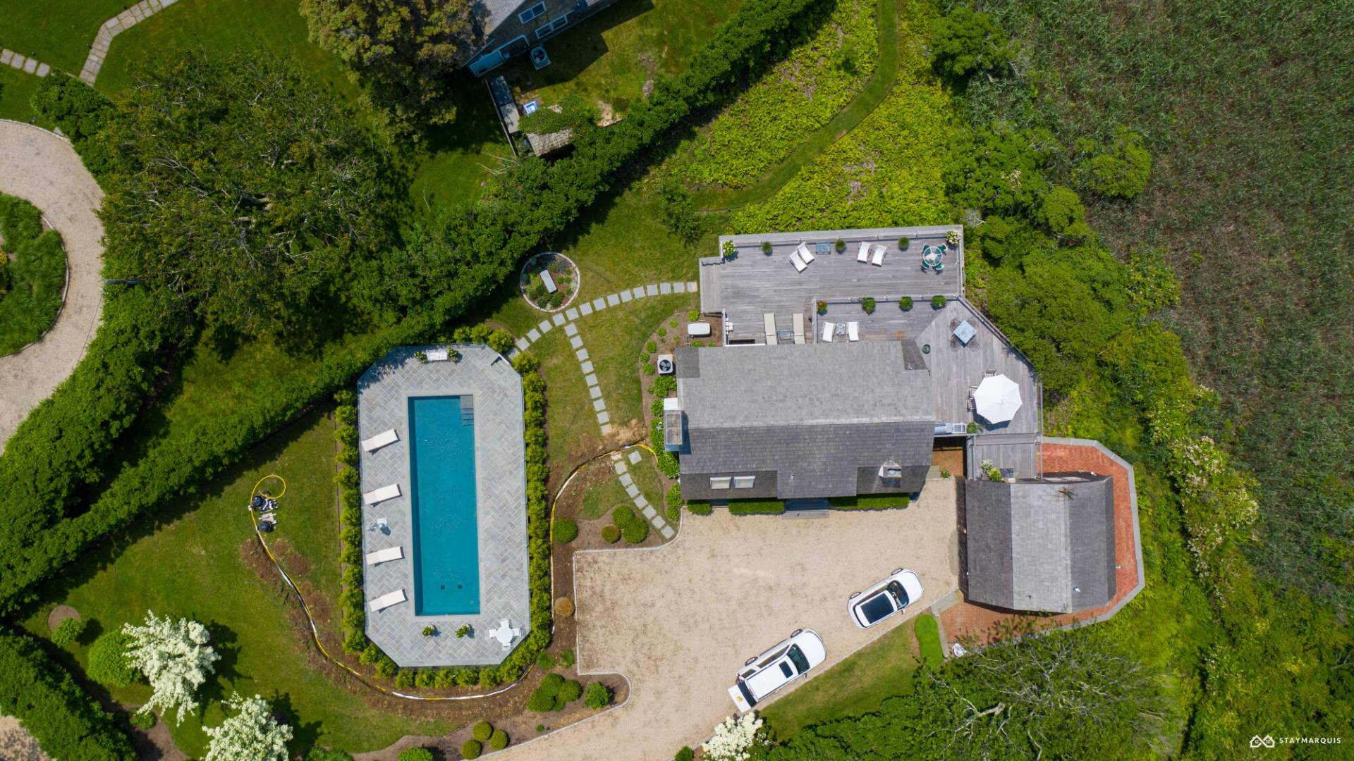 1100 Ocean Road Bridgehampton, NY 11932 - Photo 3 of 49 an aerial view of a house with a garden