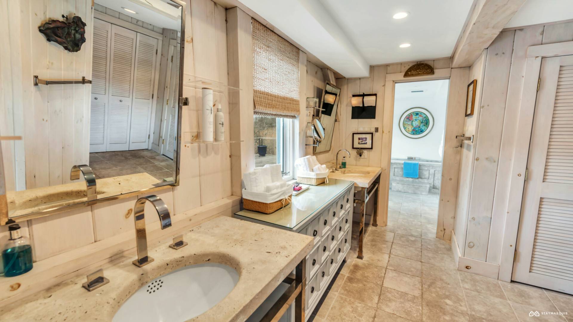 1100 Ocean Road Bridgehampton, NY 11932 - Photo 31 of 49 a bathroom with a sink double vanity and a mirror
