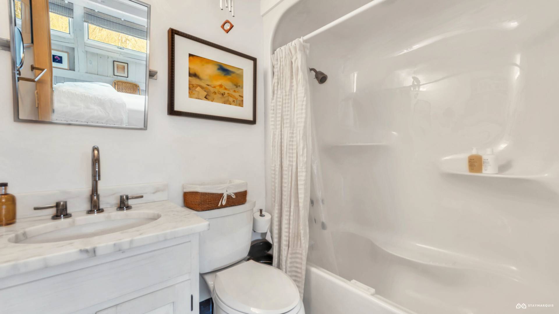 1100 Ocean Road Bridgehampton, NY 11932 - Photo 35 of 49 a bathroom with a sink and a mirror