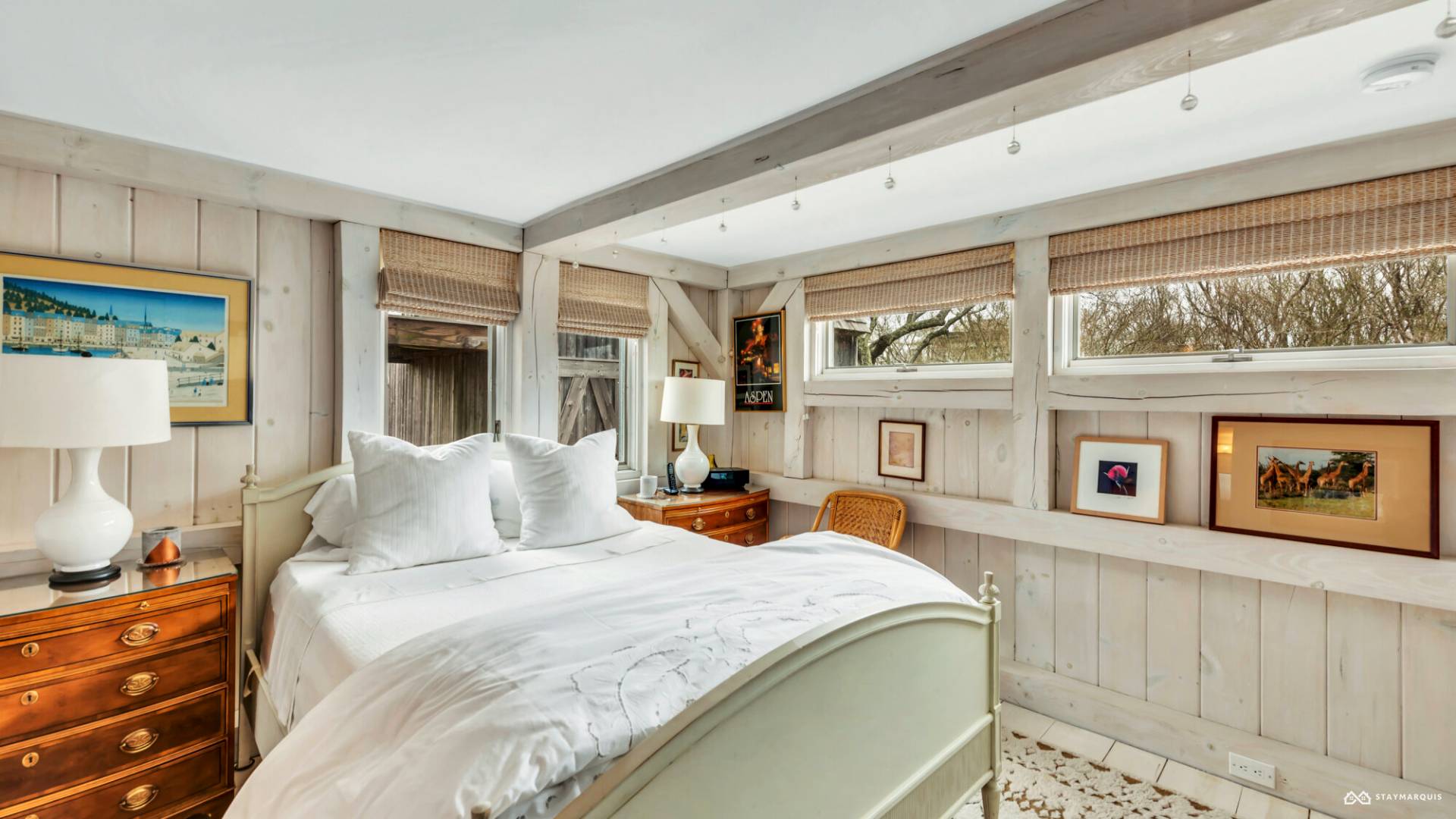 1100 Ocean Road Bridgehampton, NY 11932 - Photo 36 of 49 a bedroom with furniture and a window