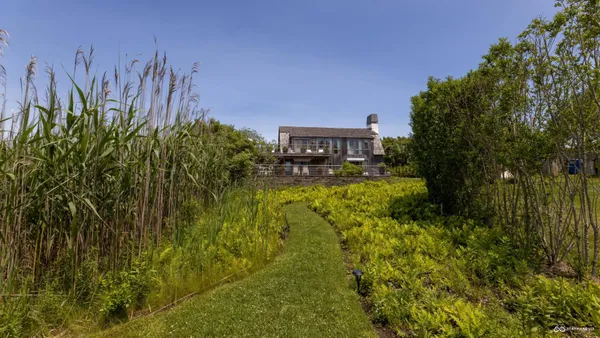 a view of sitting area with furniture on wooden deck