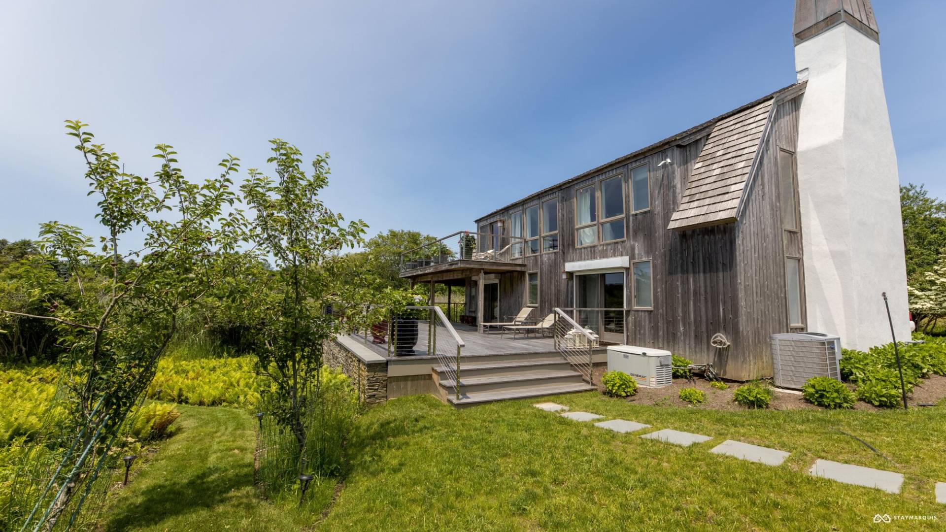 1100 Ocean Road Bridgehampton, NY 11932 - Photo 47 of 49 a front view of a house with garden