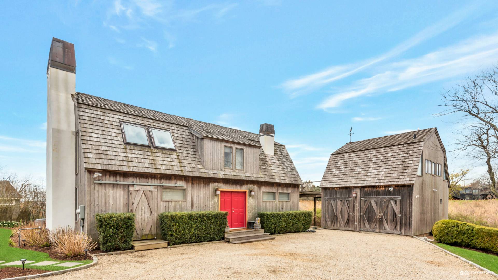 1100 Ocean Road Bridgehampton, NY 11932 - Photo 48 of 49 a front view of a house with a yard