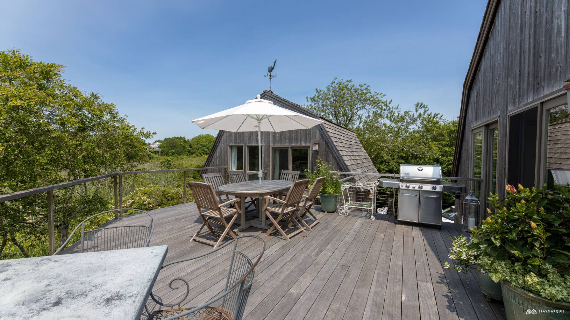 1100 Ocean Road Bridgehampton, NY 11932 - Photo 6 of 49 an outdoor space with furniture and umbrella