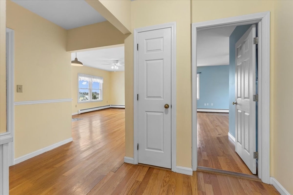 32 Barker Road, Unit 3 Scituate, MA 02066 - Photo 11 of 23 a view of a hallway with wooden floor