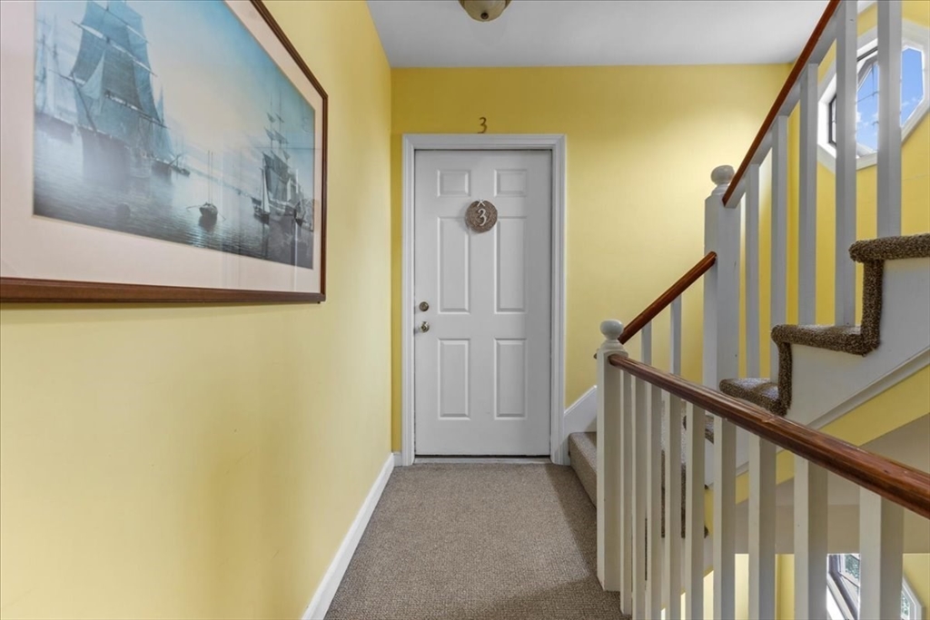 32 Barker Road, Unit 3 Scituate, MA 02066 - Photo 16 of 23 a view of a hallway with staircase
