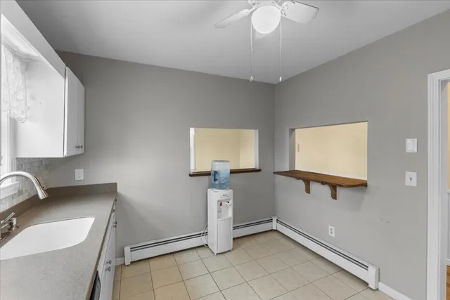 a kitchen with a refrigerator and a stove