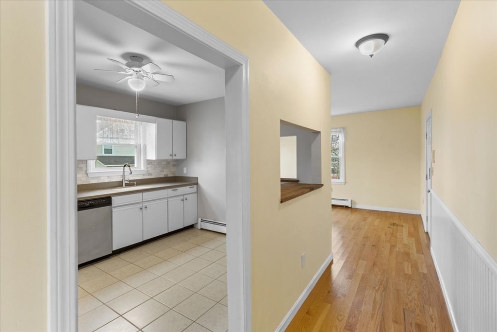 32 Barker Road, Unit 3 Scituate, MA 02066 - Photo 9 of 23 a kitchen with a refrigerator and a stove
