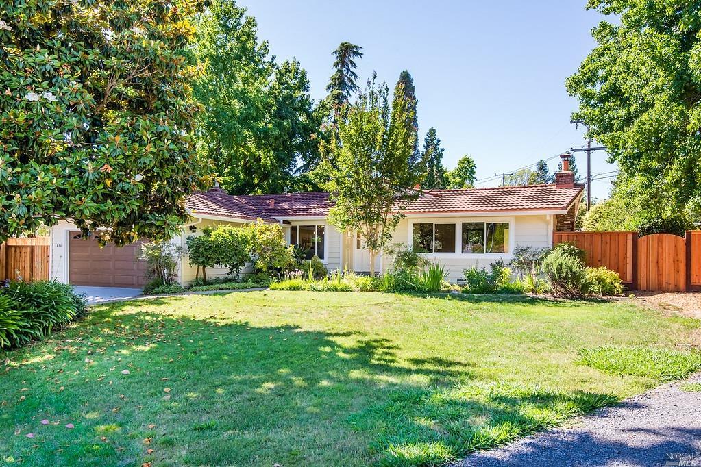 1523 Escalero Road Santa Rosa, CA 95409 - Photo 1 of 1 a front view of a house with a yard and trees