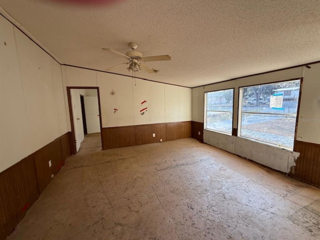217 Longview Avenue Lady Lake, FL 32159 - Photo 2 of 10 a view of an empty room with a window