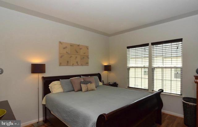 22504 Phillips Street, Unit 503 Clarksburg, MD 20871 - Photo 5 of 7 a bedroom with a bed and a window