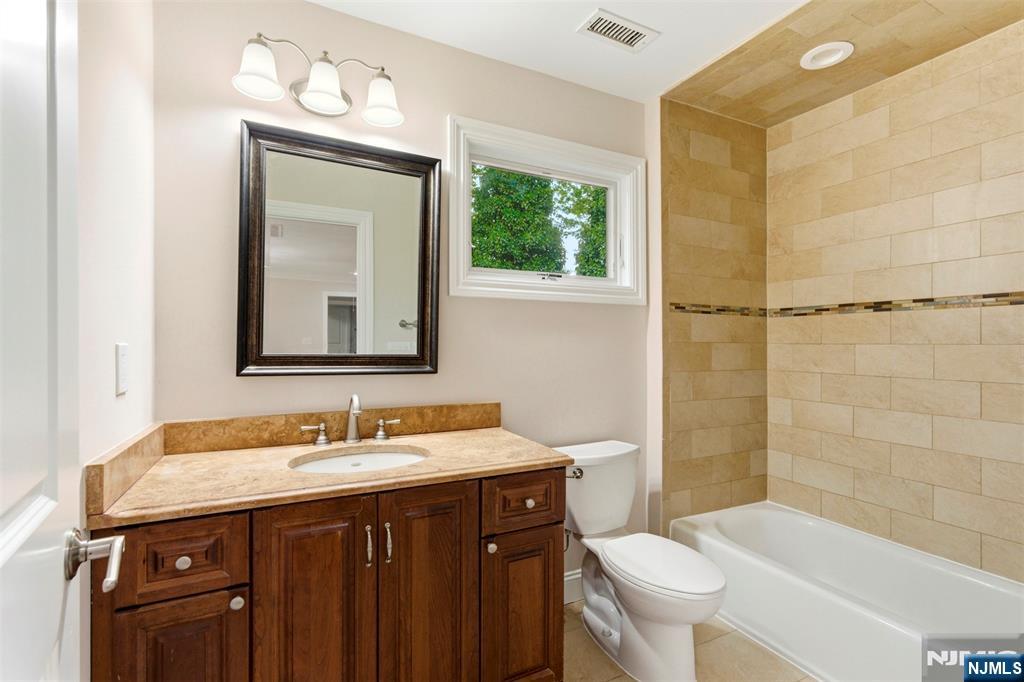 767 Orangeburgh Road River Vale, NJ 07675 - Photo 25 of 49 a bathroom with a sink vanity mirror and toilet