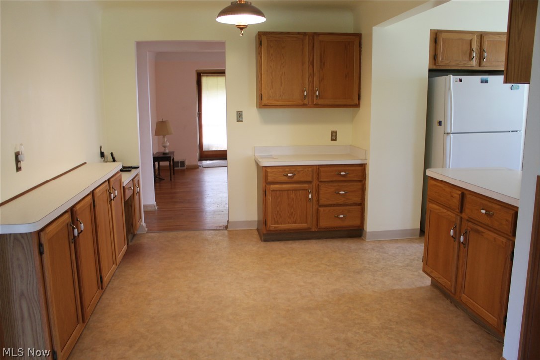 14863 Turney Road Maple Heights, OH 44137 - Photo 7 of 34 Kitchen featuring light wood-type flooring and white fridge