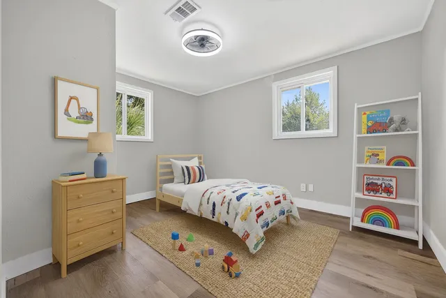 a bedroom with a bed and cabinets